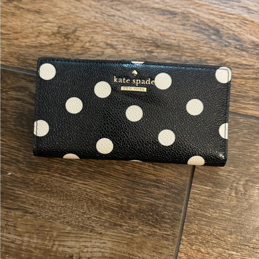 Black with white Polk a dots wallet by Kate Spade